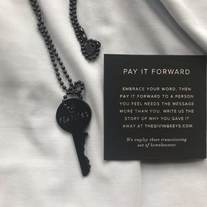 “The Giving Key” necklace in matte black, fearless